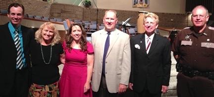 Dr. G. Ted Taylor, director of the Big Maroon Club at  Campbellsville University, second from left, challenged  graduates to live lives to receive God’s grace and favor  in his address at the baccalaureate service of Pulaski County’s  Southwestern High School recently at Beacon Hill Baptist Church  in Somerset, Ky. With him, from left, are -- Deputy Kenny  Upchurch; Steve Butcher, superintendent of Pulaski County  School System; Lana Brainard and Cindy Brainard, coordinators  of the service and teachers at SWHS; and the Rev. Donavon  Burton, pastor of Beacon Hill Baptist Church.